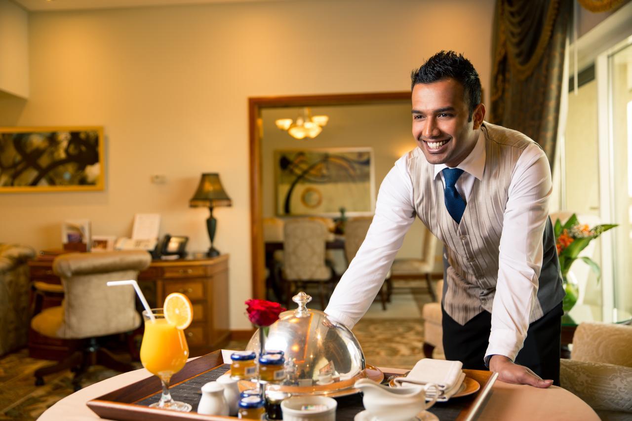 Officers Club & Hotel Abu Dhabi Eksteriør bilde A room service attendant